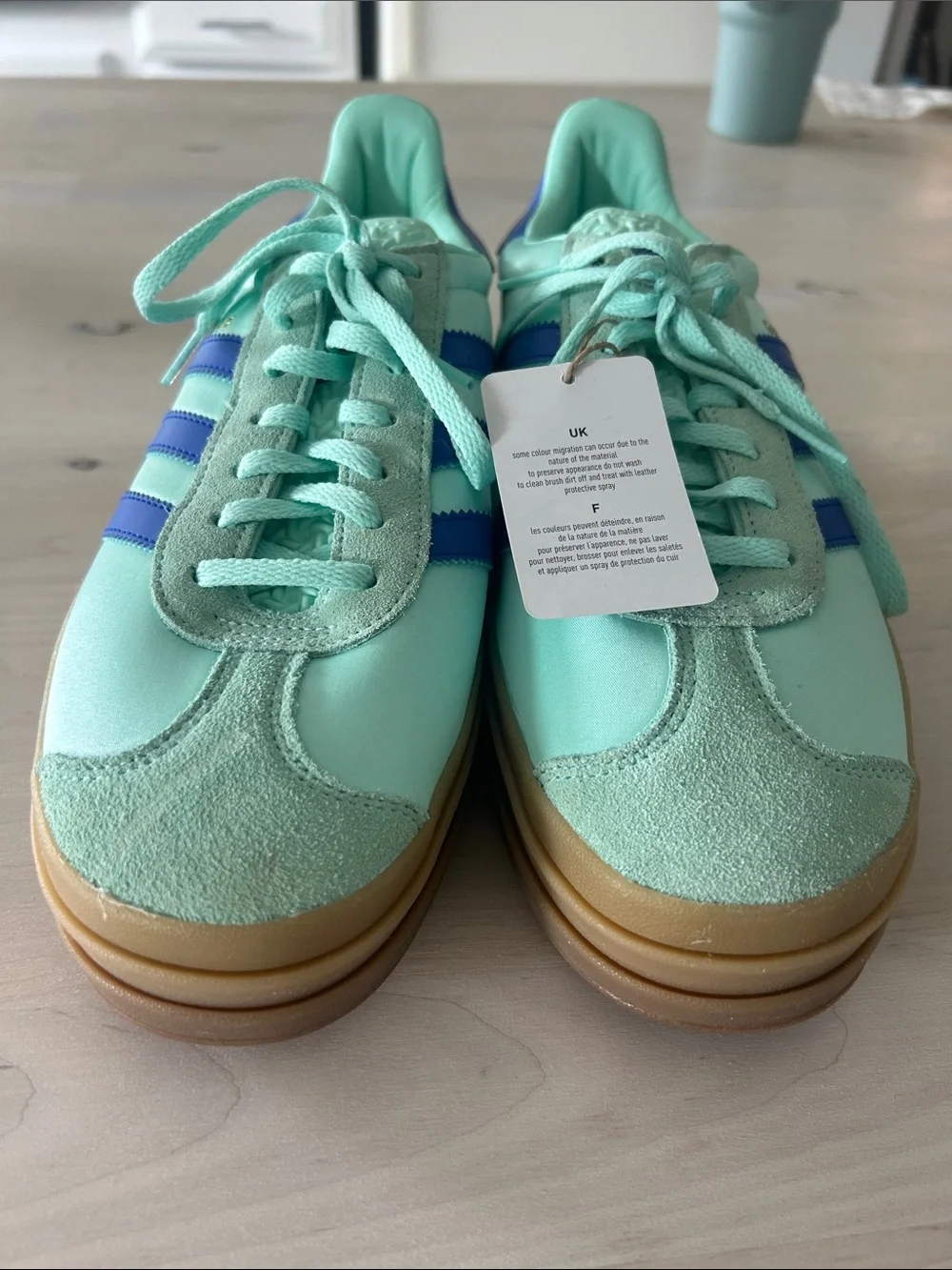 adidas Women’s Mint Green Sneakers with Blue Stripes